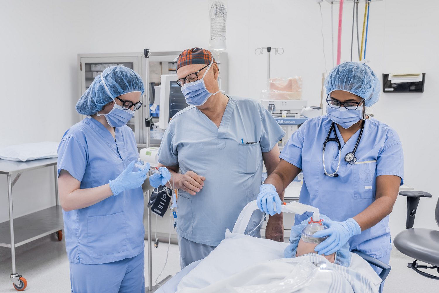 Doctors working on patient in operating room